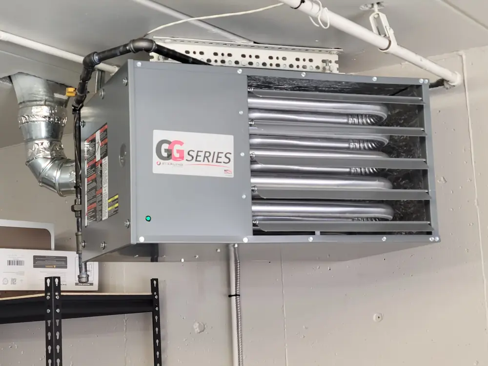 A commercial unit heater Diego hung in a shop